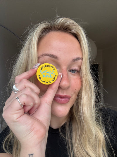 Customer holding WOWBROW Brow Styling Wax product